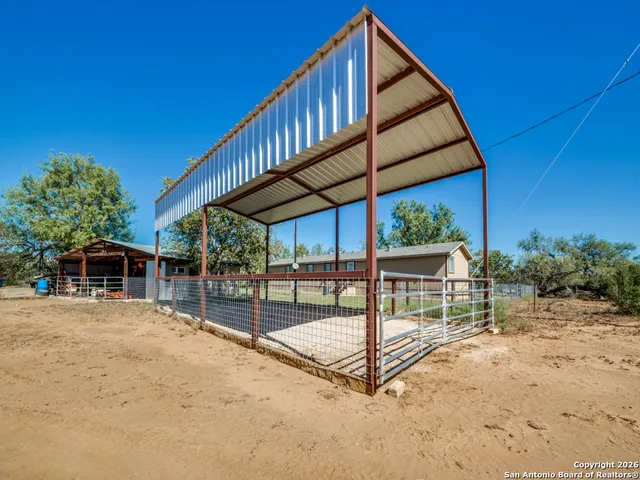 a view of backyard with a patio and a garden