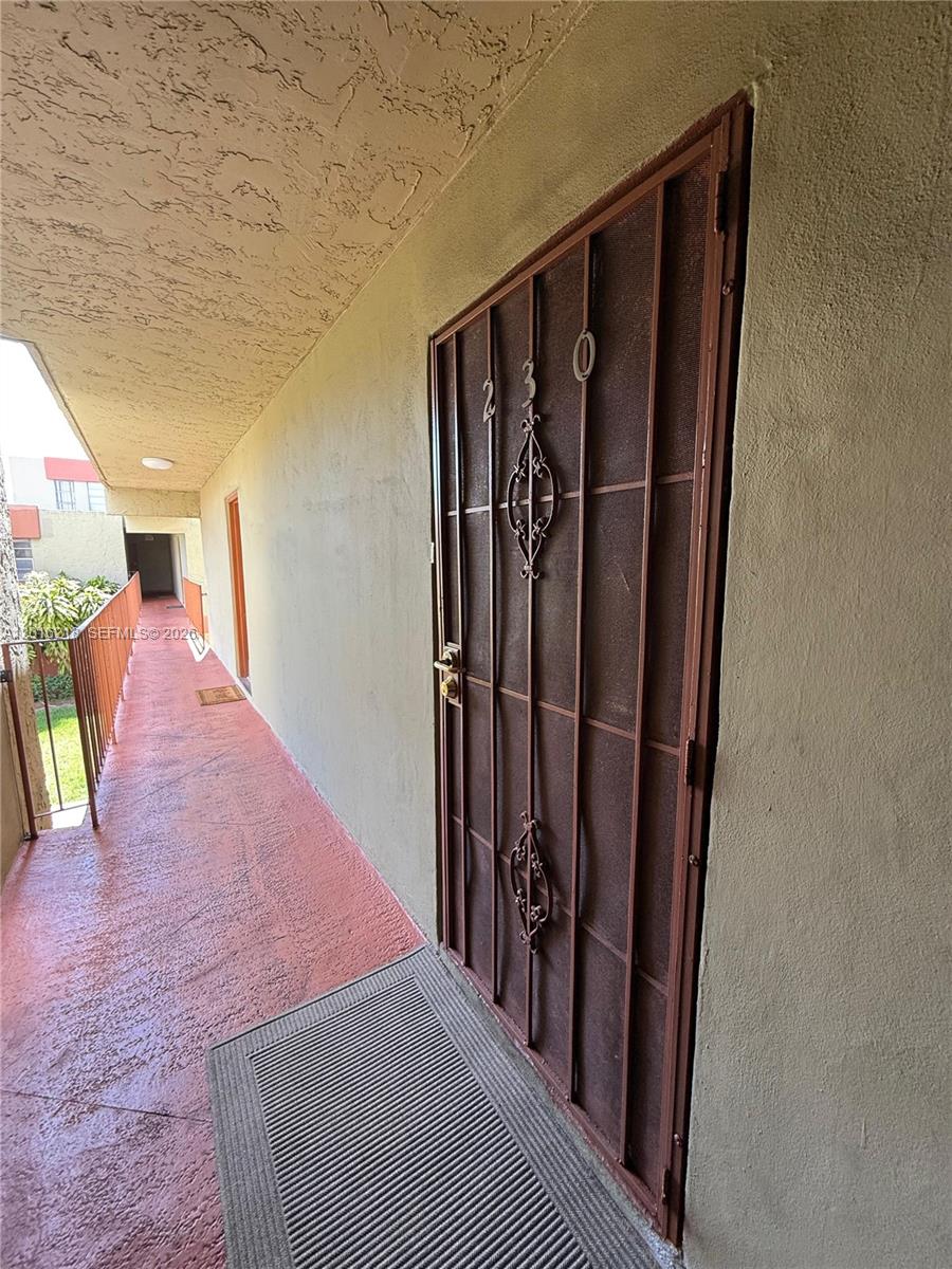 9321 Southwest 4th Street, Unit 230C Miami, FL 33174 - Photo 3 of 37 a view of a hallway