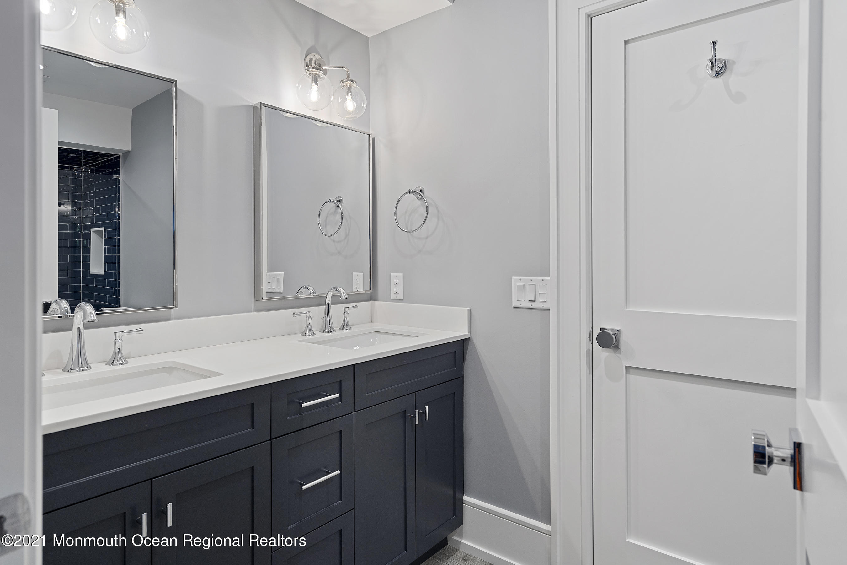 101 Ludlow Avenue Spring Lake, NJ 07762 - Photo 109 of 162 a bathroom with a double vanity sink and mirror