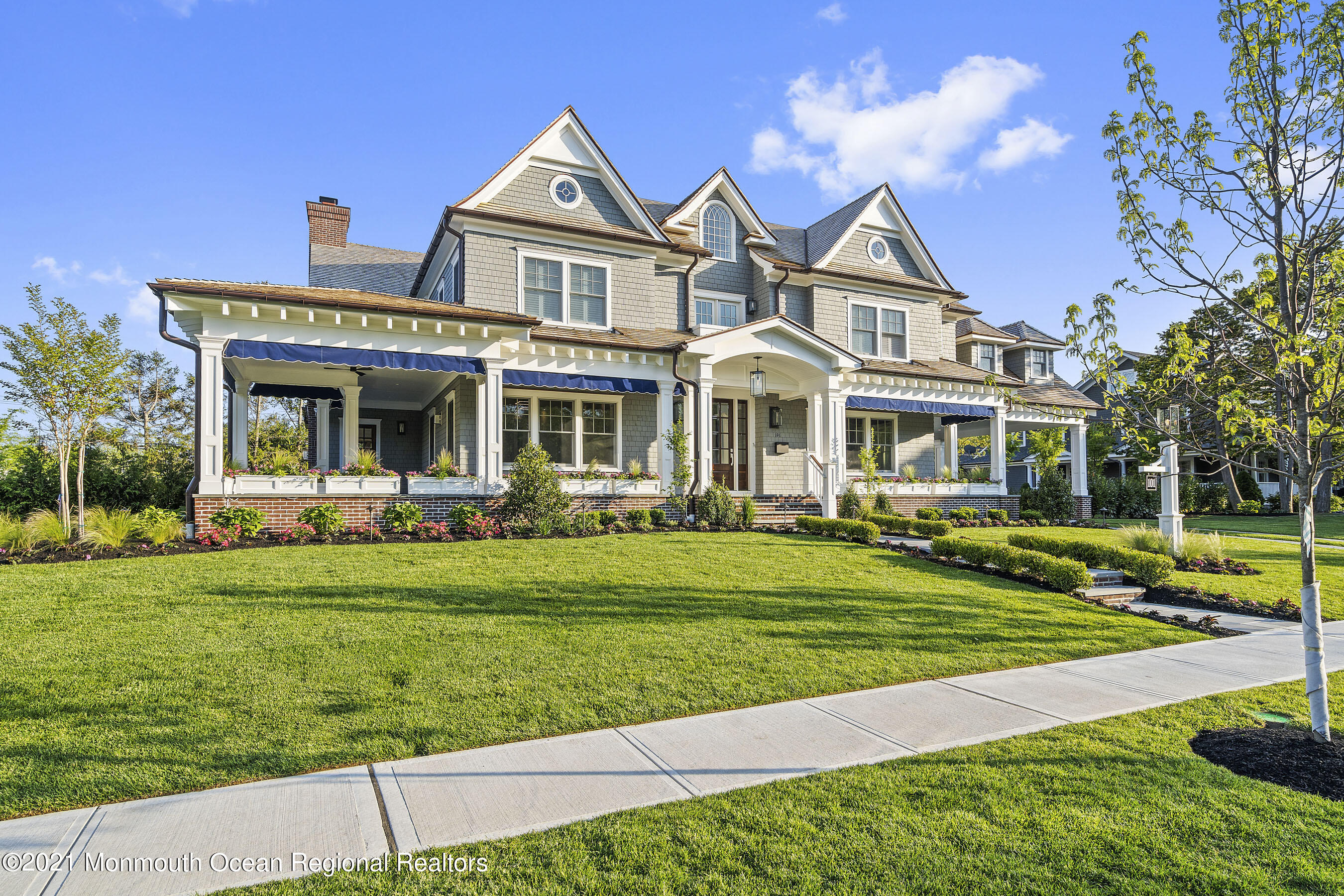 101 Ludlow Avenue Spring Lake, NJ 07762 - Photo 12 of 162 a front view of a house with a yard table and chairs