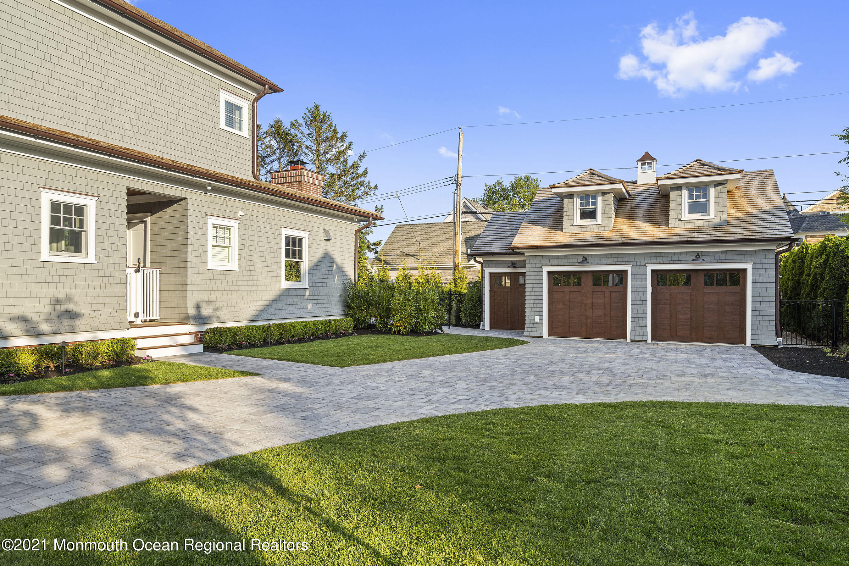 101 Ludlow Avenue Spring Lake, NJ 07762 - Photo 133 of 162 a front view of a house with a yard and garage