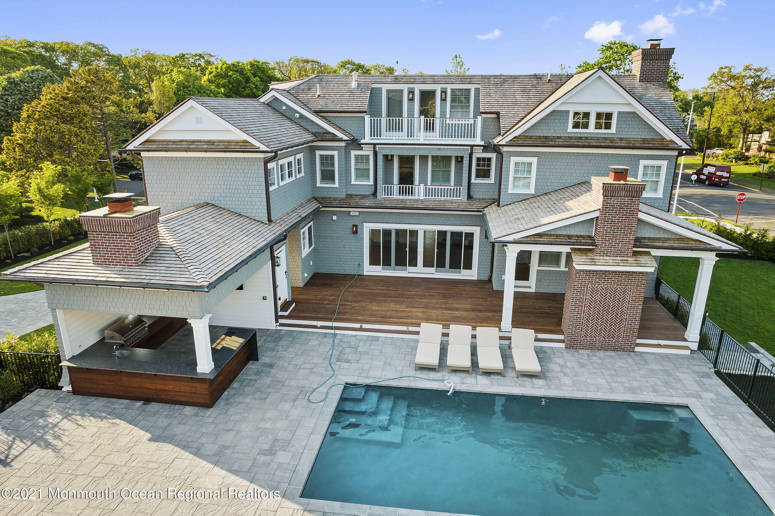 101 Ludlow Avenue Spring Lake, NJ 07762 - Photo 143 of 162 a front view of a house with a yard table and chairs