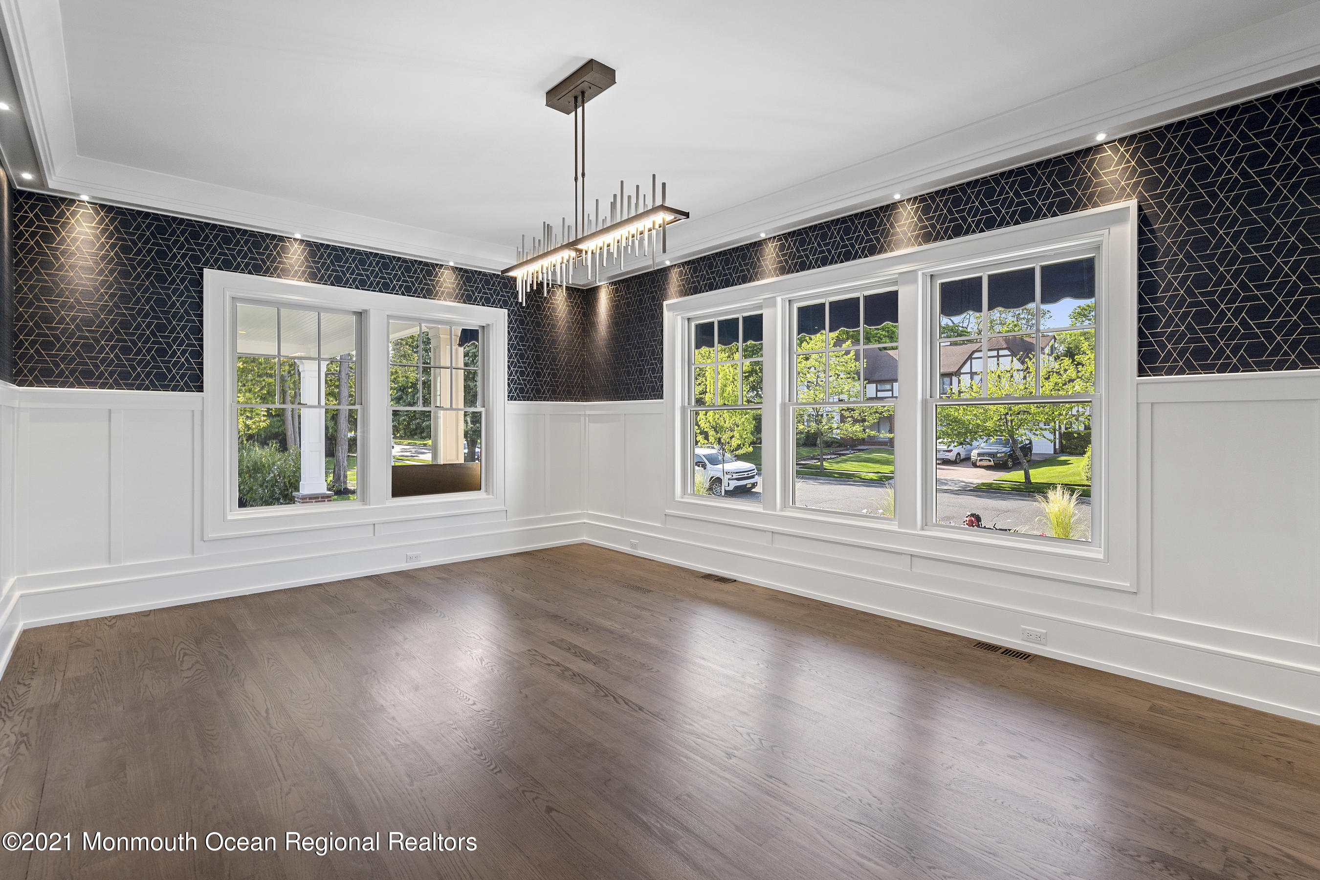 101 Ludlow Avenue Spring Lake, NJ 07762 - Photo 22 of 162 a view of an empty room with wooden floor and a window