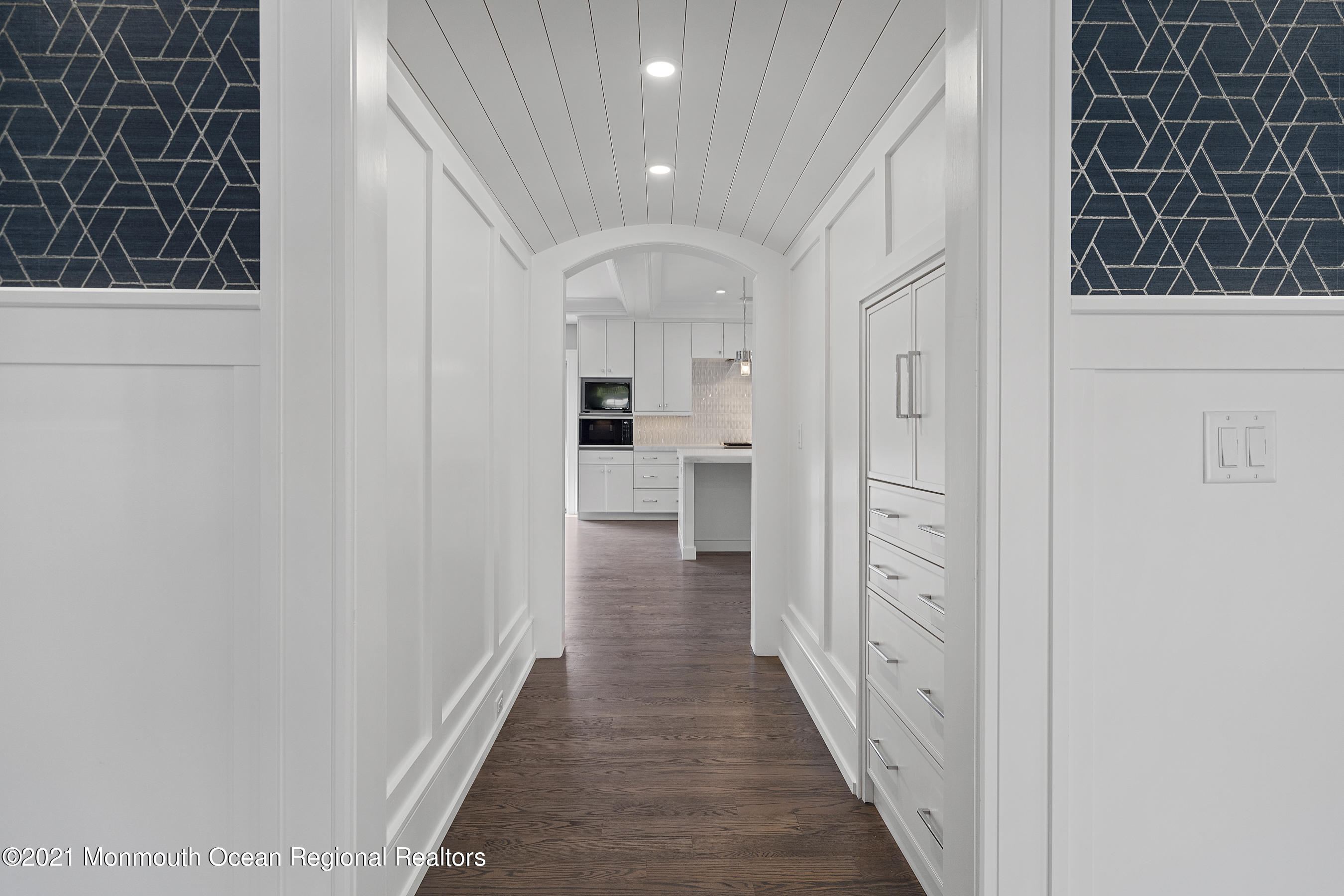 101 Ludlow Avenue Spring Lake, NJ 07762 - Photo 24 of 162 a view of a hallway with wooden floor and a living room