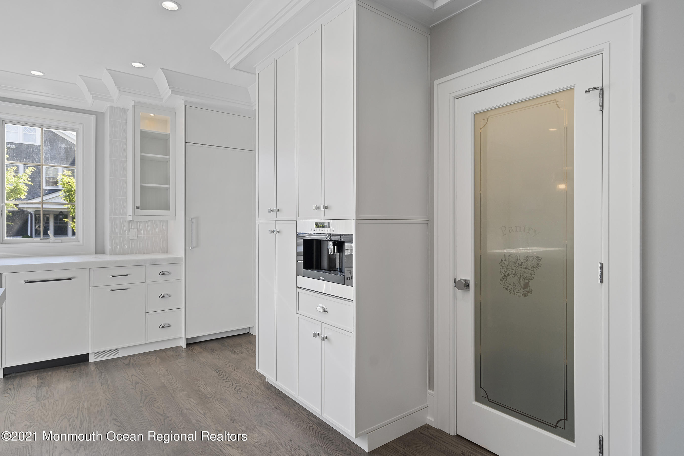 101 Ludlow Avenue Spring Lake, NJ 07762 - Photo 31 of 162 a kitchen with white cabinets and white appliances