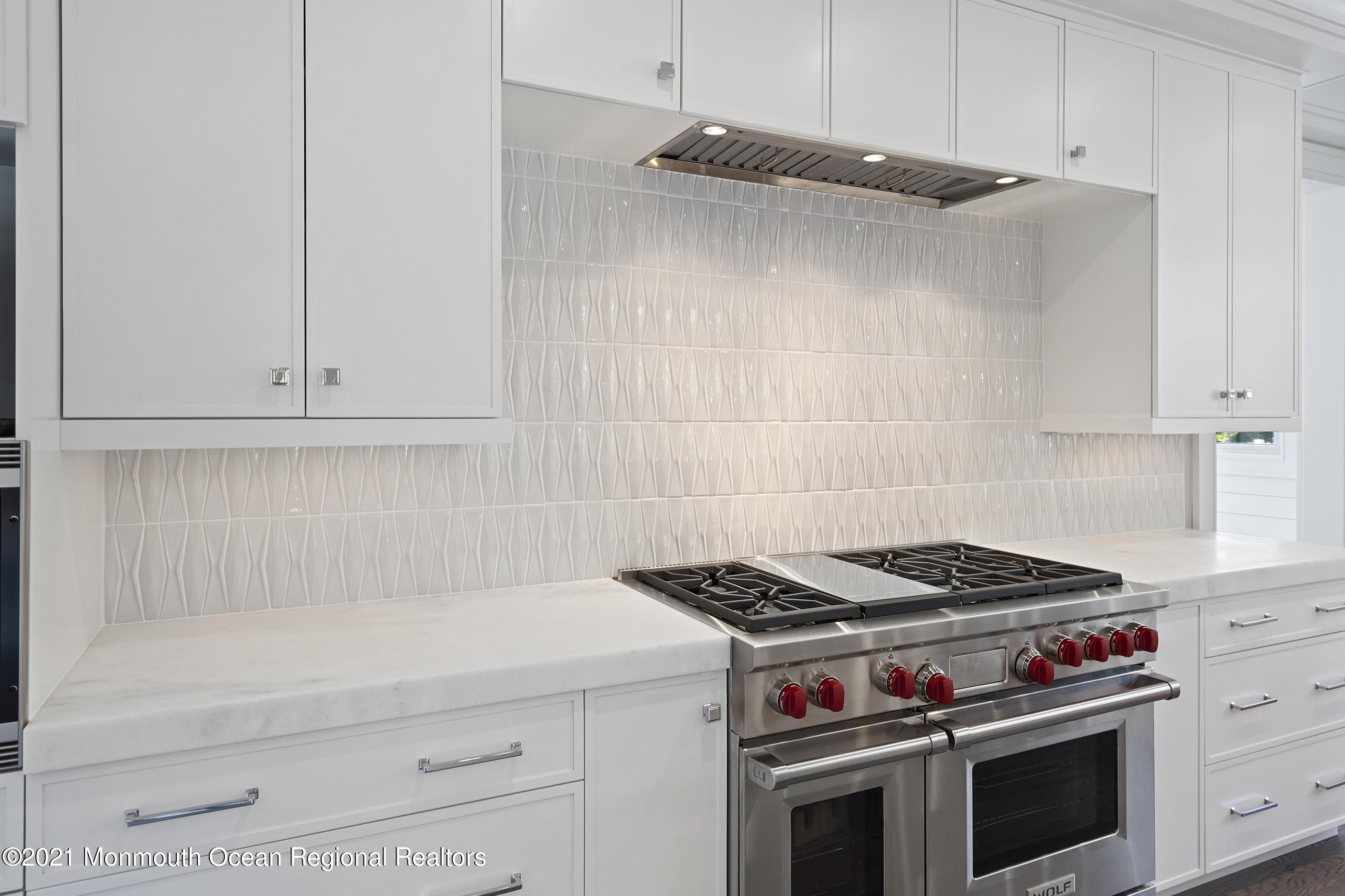 101 Ludlow Avenue Spring Lake, NJ 07762 - Photo 37 of 162 a kitchen with white cabinets and appliances
