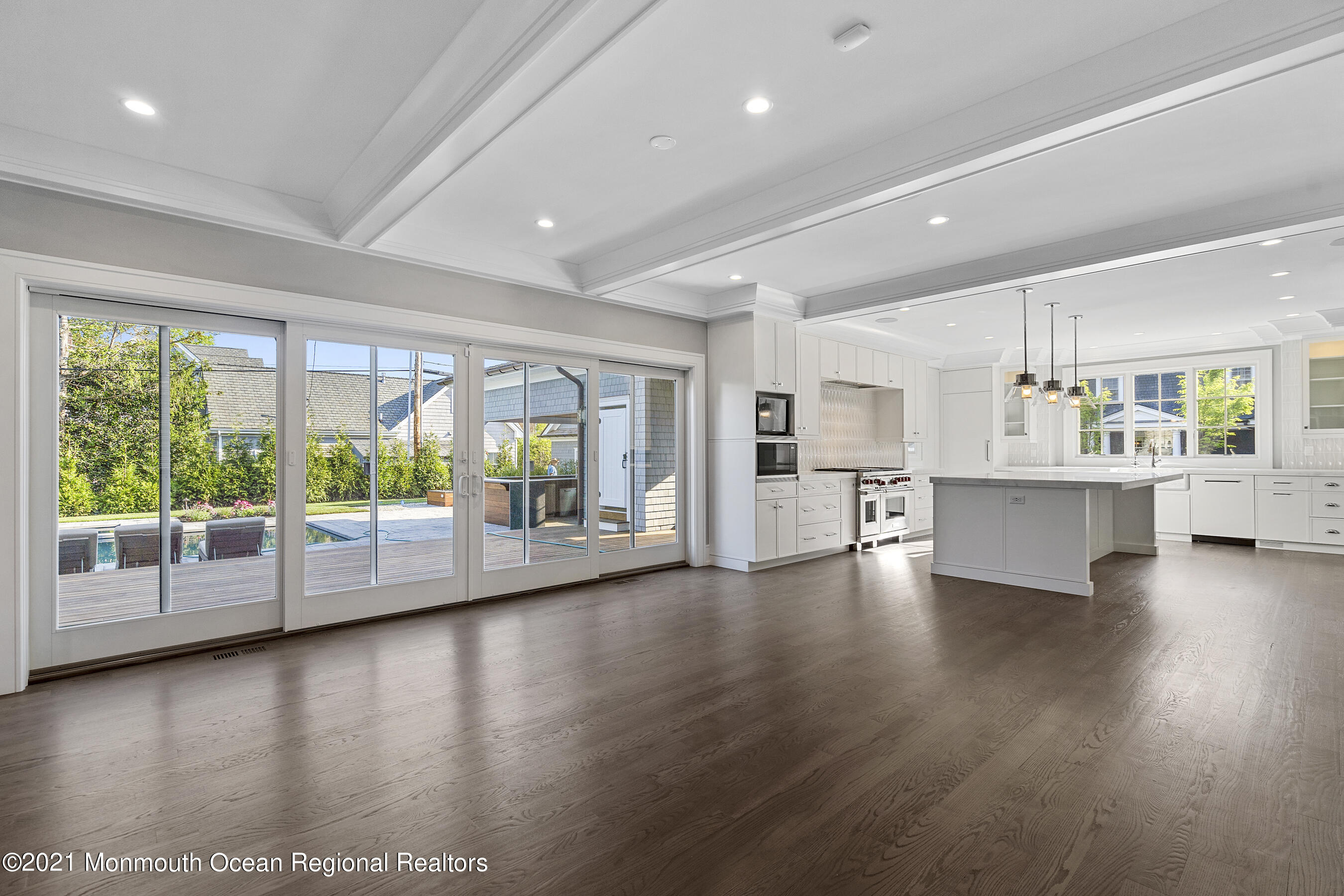 101 Ludlow Avenue Spring Lake, NJ 07762 - Photo 52 of 162 a view of an empty room with wooden floor and a window