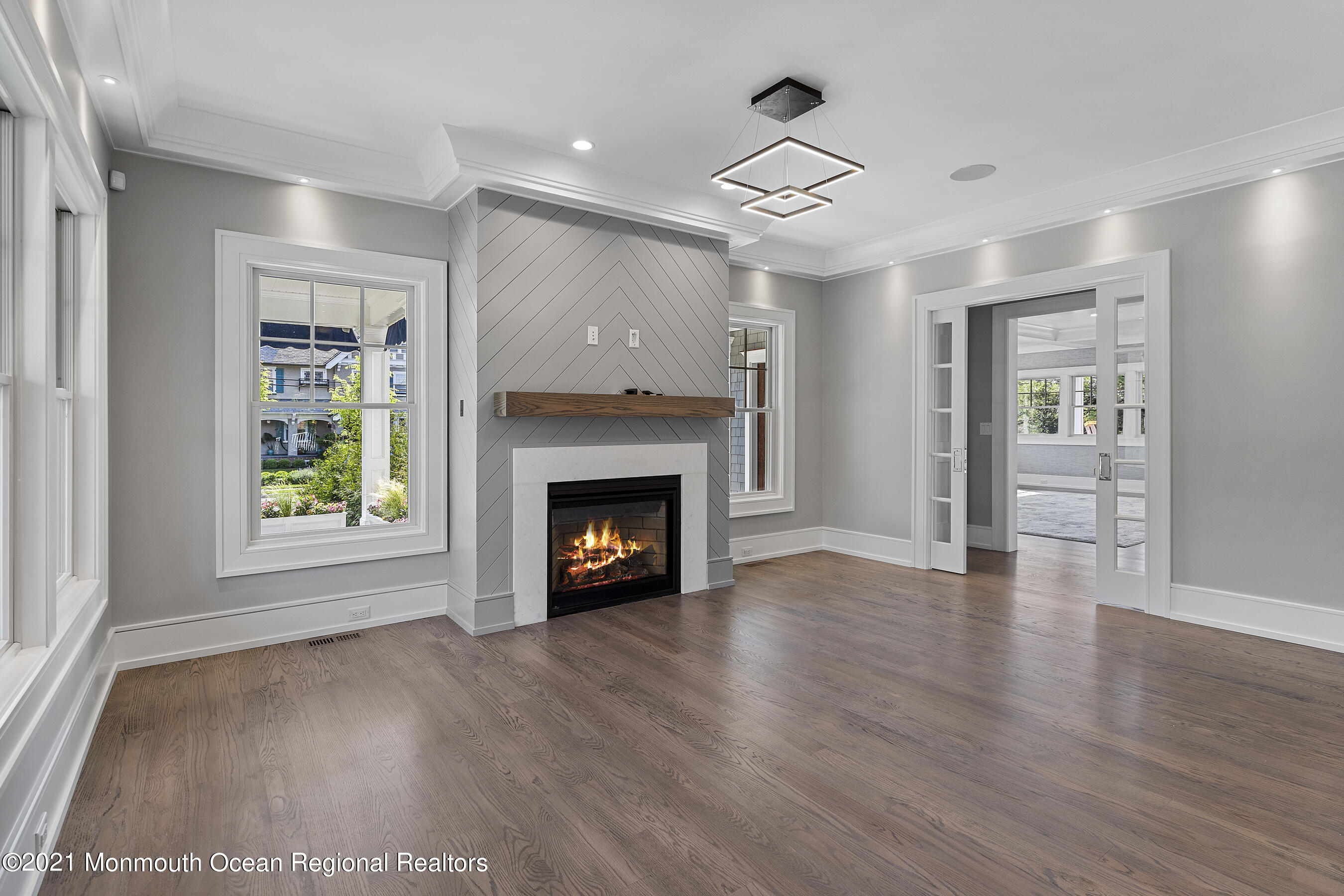 101 Ludlow Avenue Spring Lake, NJ 07762 - Photo 61 of 162 a view of an empty room with wooden floor fireplace and a window