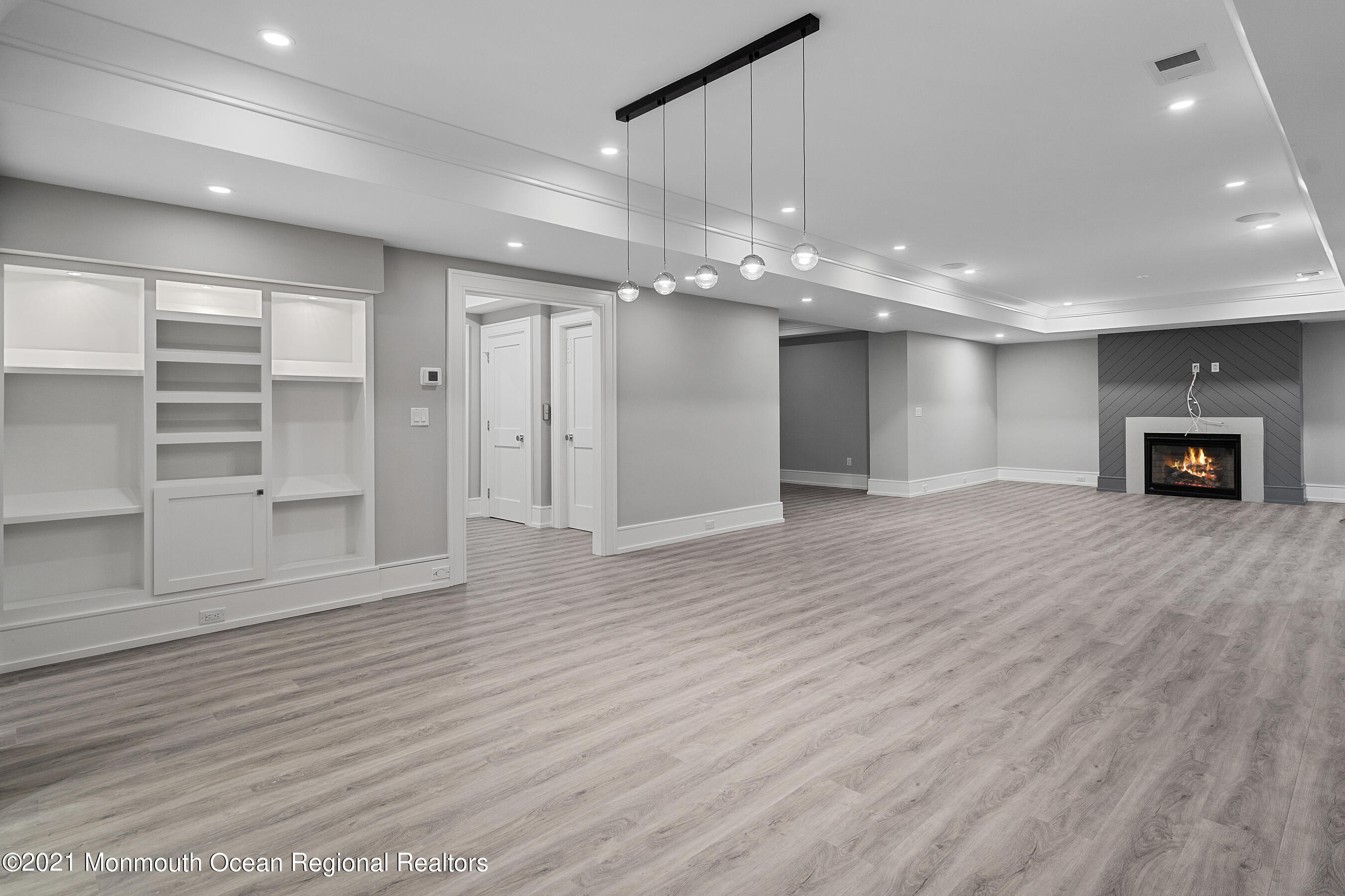 101 Ludlow Avenue Spring Lake, NJ 07762 - Photo 69 of 162 a view of an empty room with wooden floor and a window