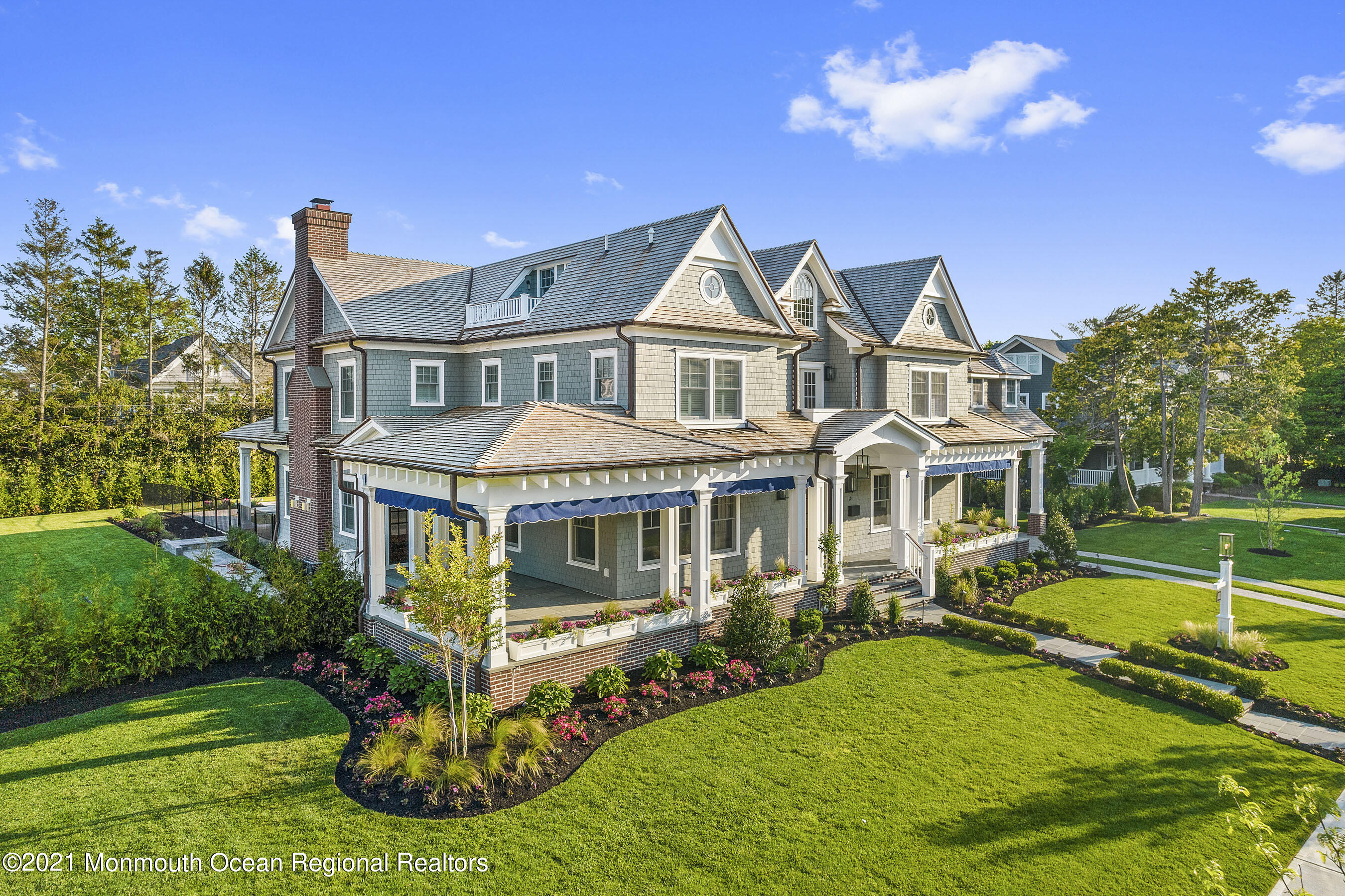 101 Ludlow Avenue Spring Lake, NJ 07762 - Photo 8 of 162 a front view of a house with a yard table and chairs