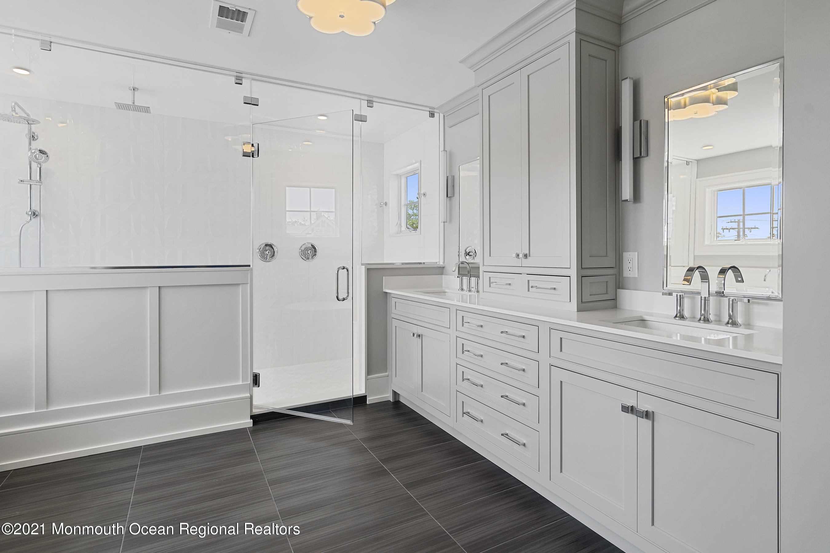 101 Ludlow Avenue Spring Lake, NJ 07762 - Photo 95 of 162 a spacious bathroom with a granite countertop sink and a mirror
