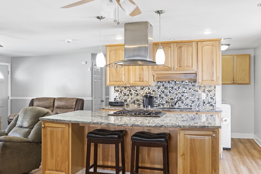 134 Deanna Road Brockton, MA 02302 - Photo 11 of 33 a kitchen with granite countertop a sink and cabinets