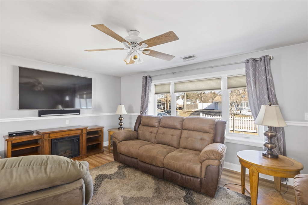134 Deanna Road Brockton, MA 02302 - Photo 13 of 33 a living room with furniture and a flat screen tv
