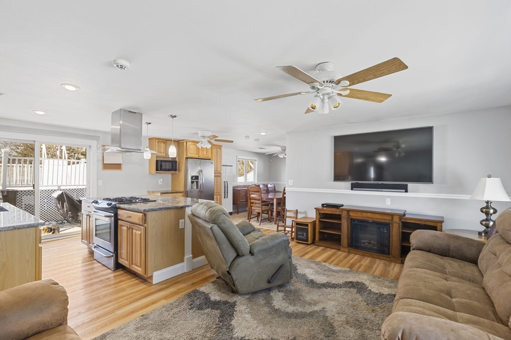 134 Deanna Road Brockton, MA 02302 - Photo 17 of 33 a living room with furniture and a flat screen tv