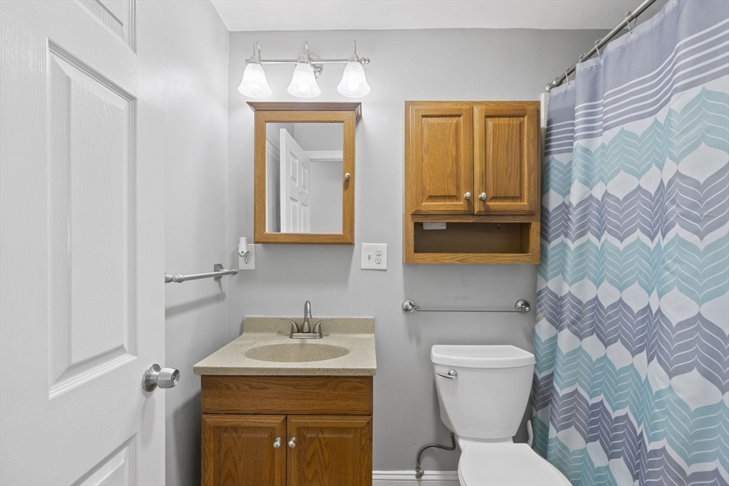 134 Deanna Road Brockton, MA 02302 - Photo 23 of 33 a bathroom with a toilet sink and mirror