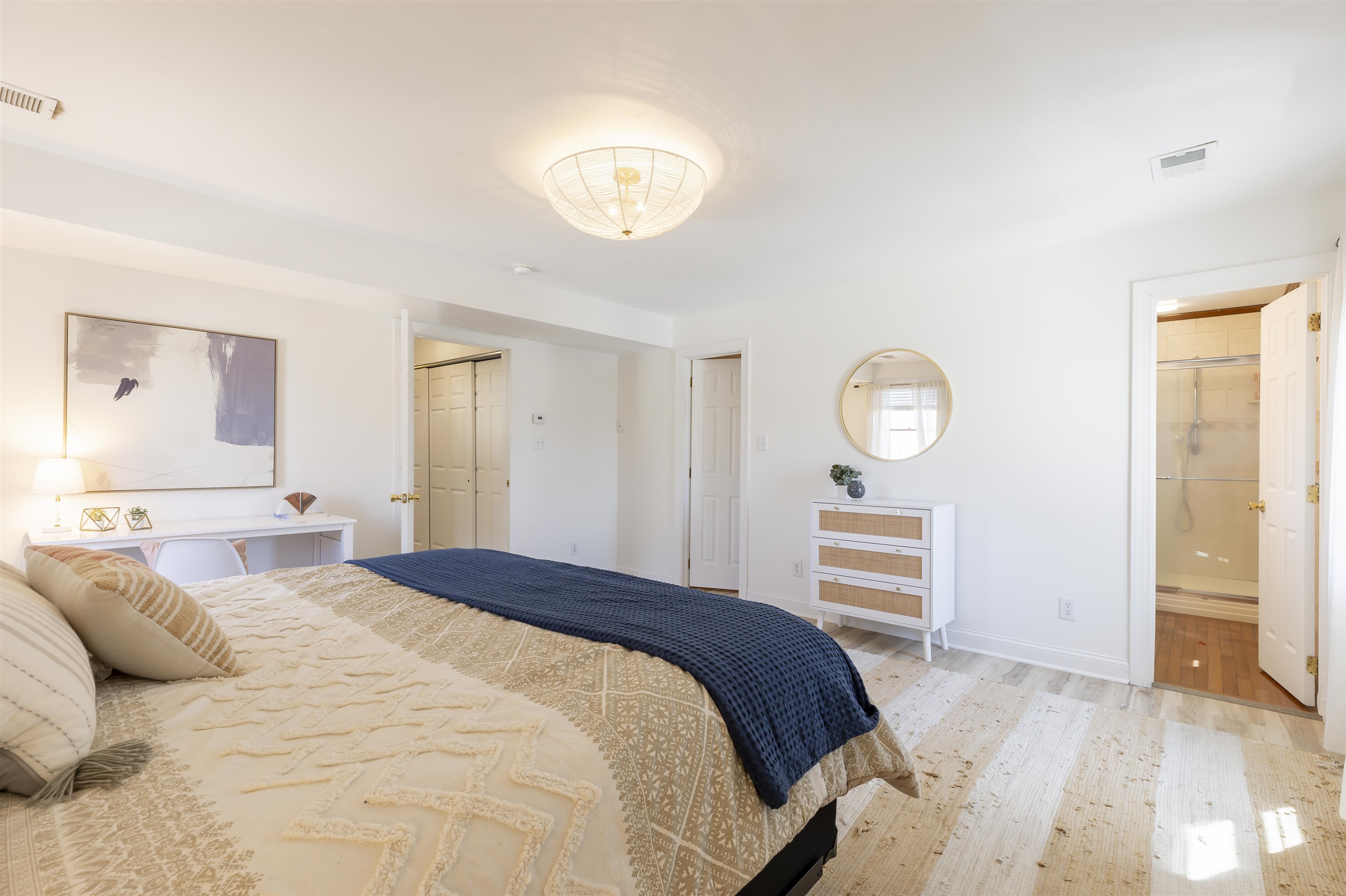 50 Birch Road Villas, NJ 08251 - Photo 22 of 50 a bedroom with a large bed and wooden floor