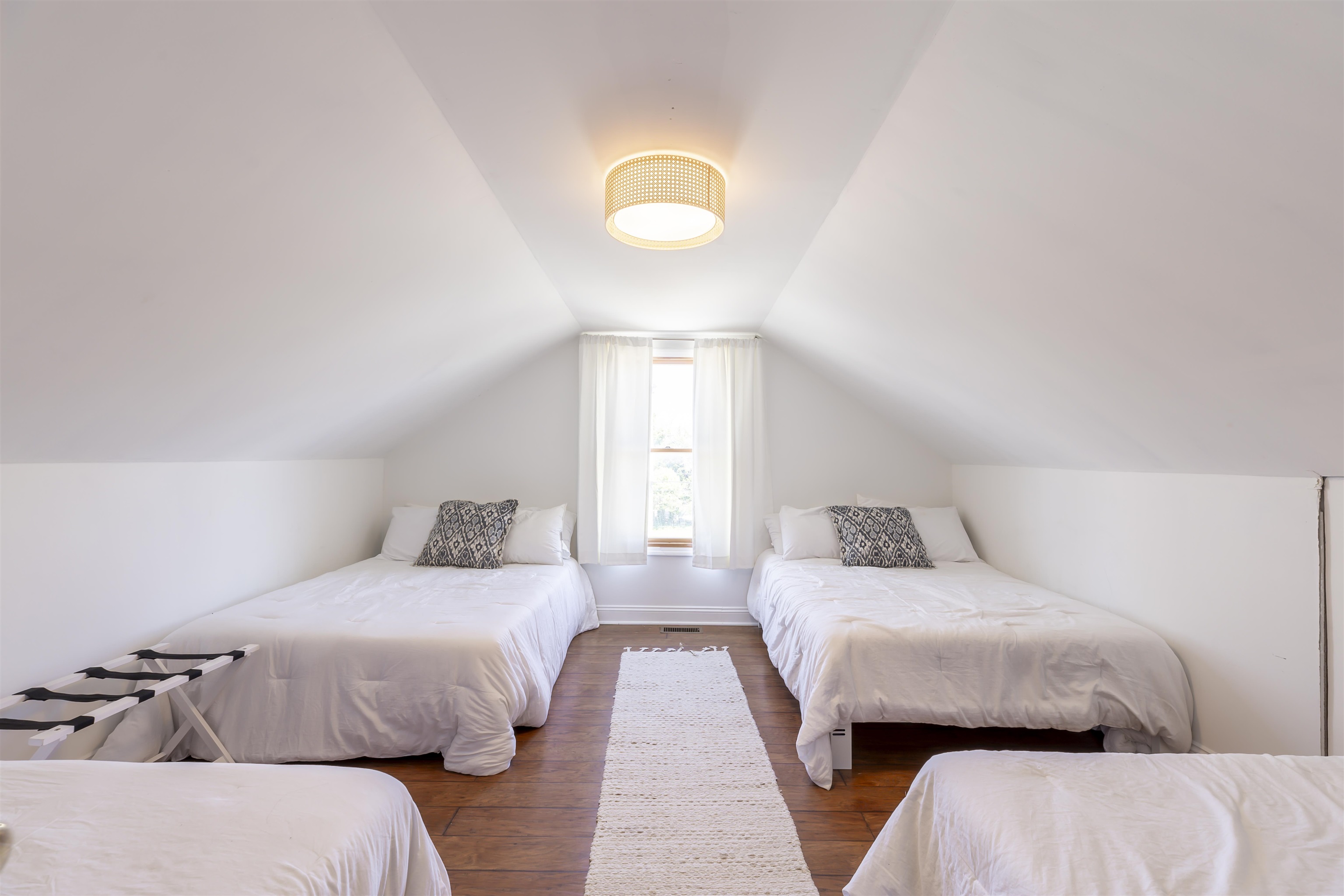 50 Birch Road Villas, NJ 08251 - Photo 38 of 50 a bedroom with two beds and a lamp with wooden floor