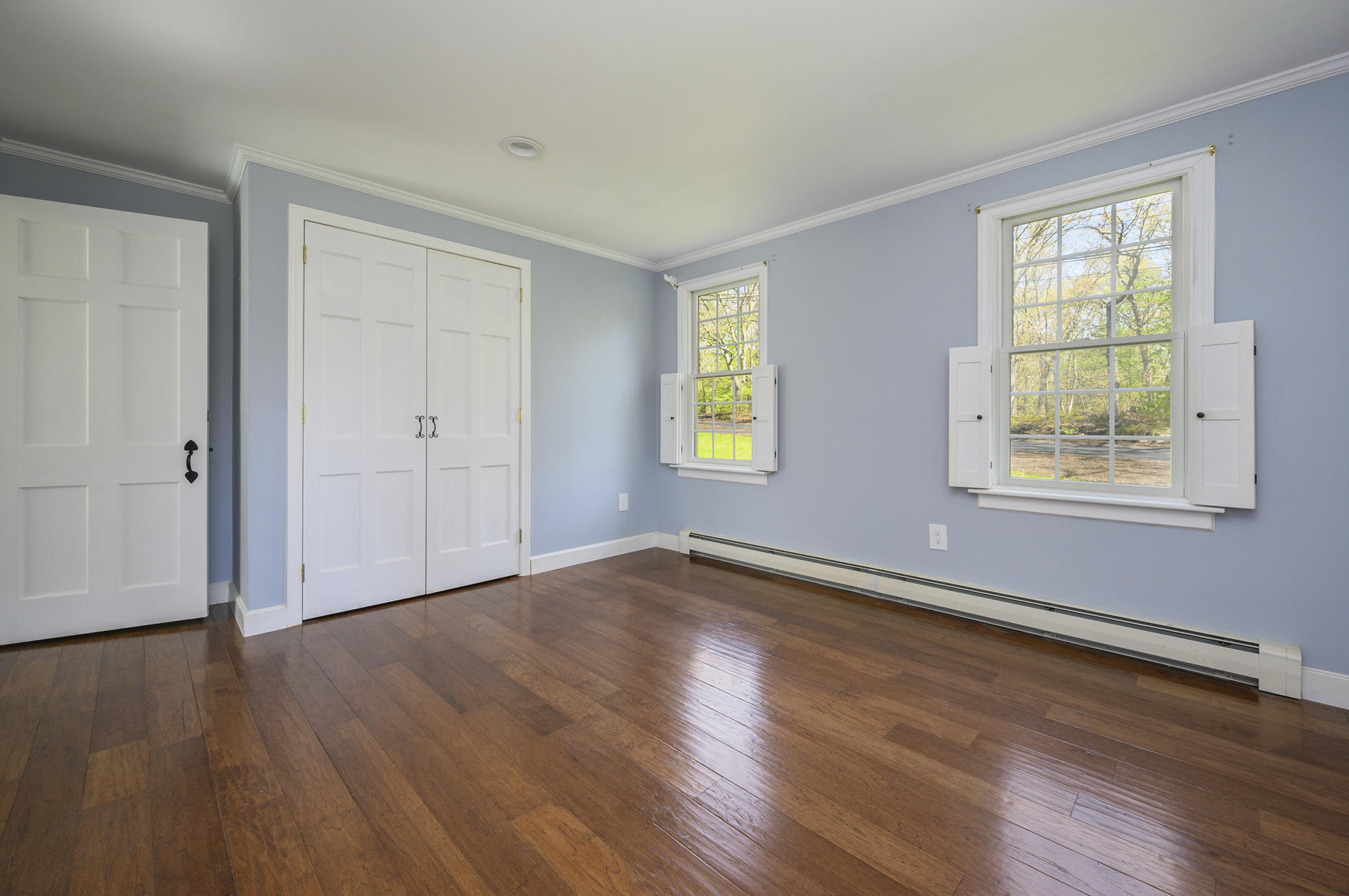 129 Richardson Road Centerville, MA 02632 - Photo 10 of 24 a view of an empty room with wooden floor and a window