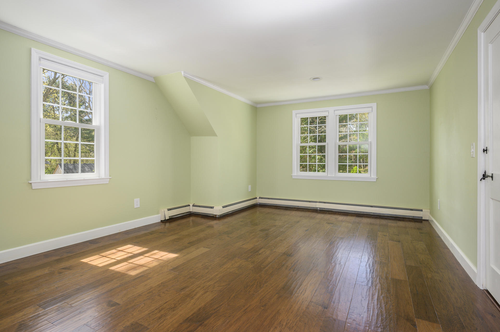 129 Richardson Road Centerville, MA 02632 - Photo 13 of 24 an empty room with wooden floor and windows