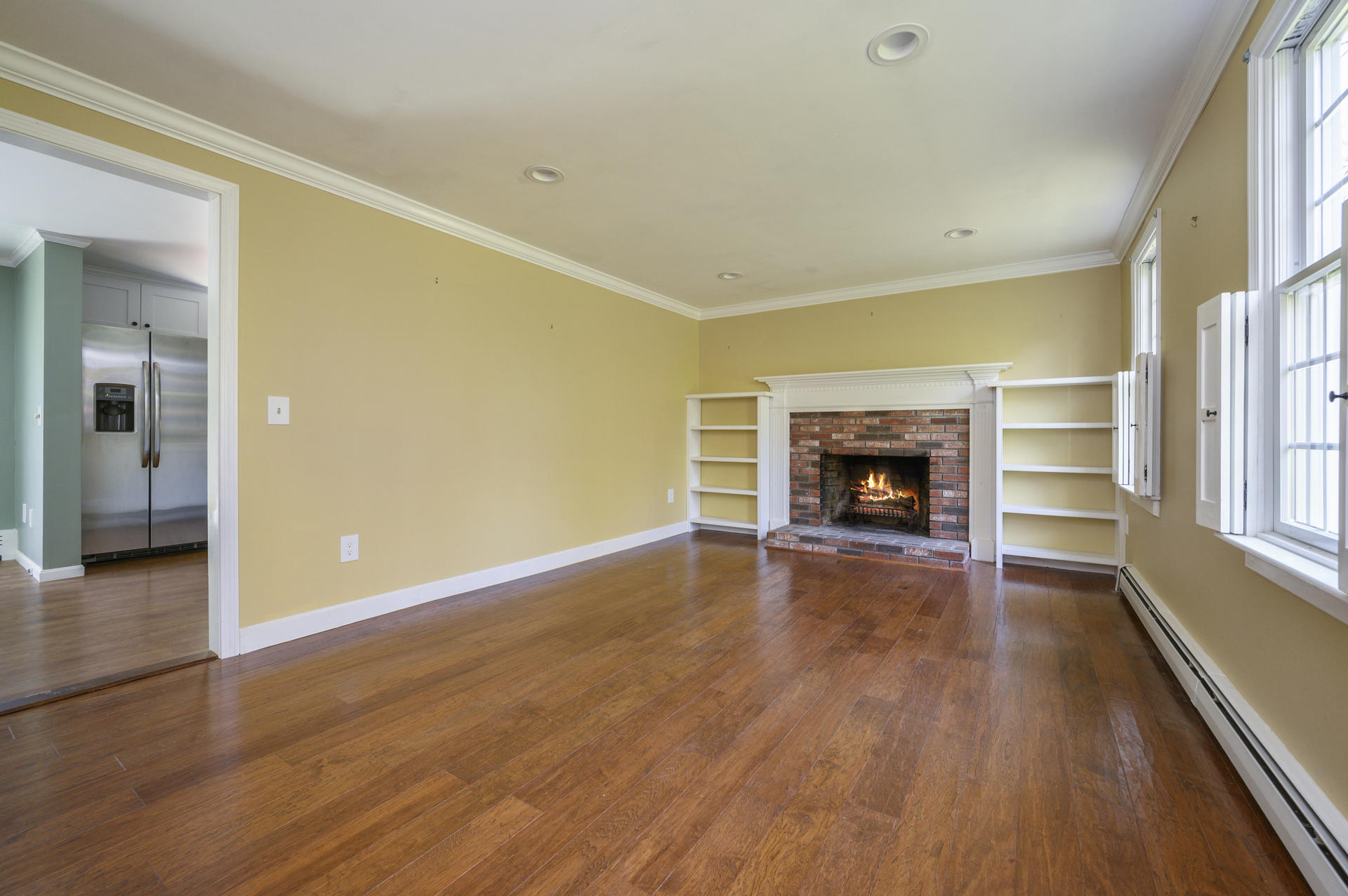129 Richardson Road Centerville, MA 02632 - Photo 4 of 24 wooden floor fireplace and natural light in room