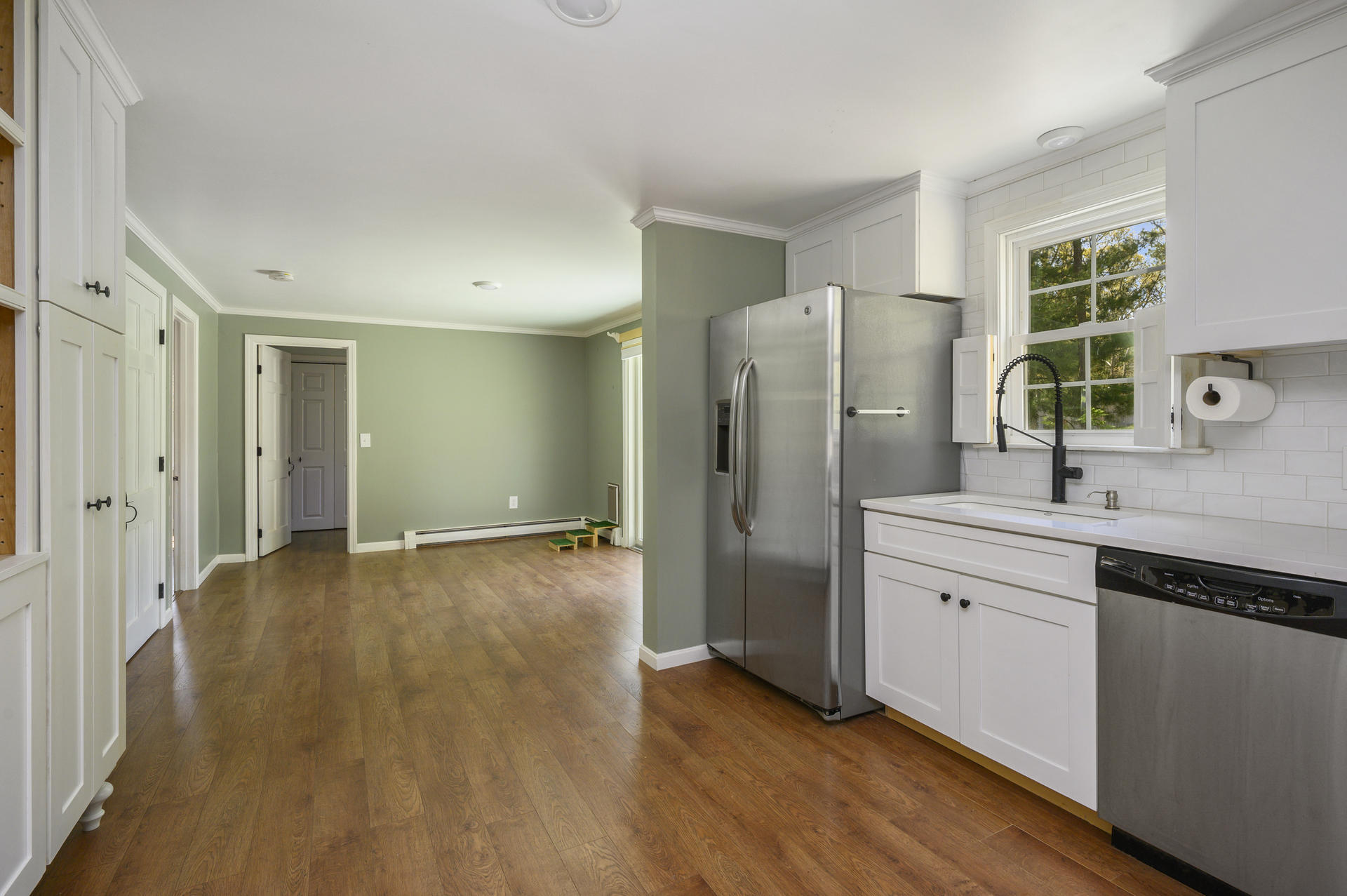 129 Richardson Road Centerville, MA 02632 - Photo 8 of 24 a kitchen with stainless steel appliances a refrigerator and a sink