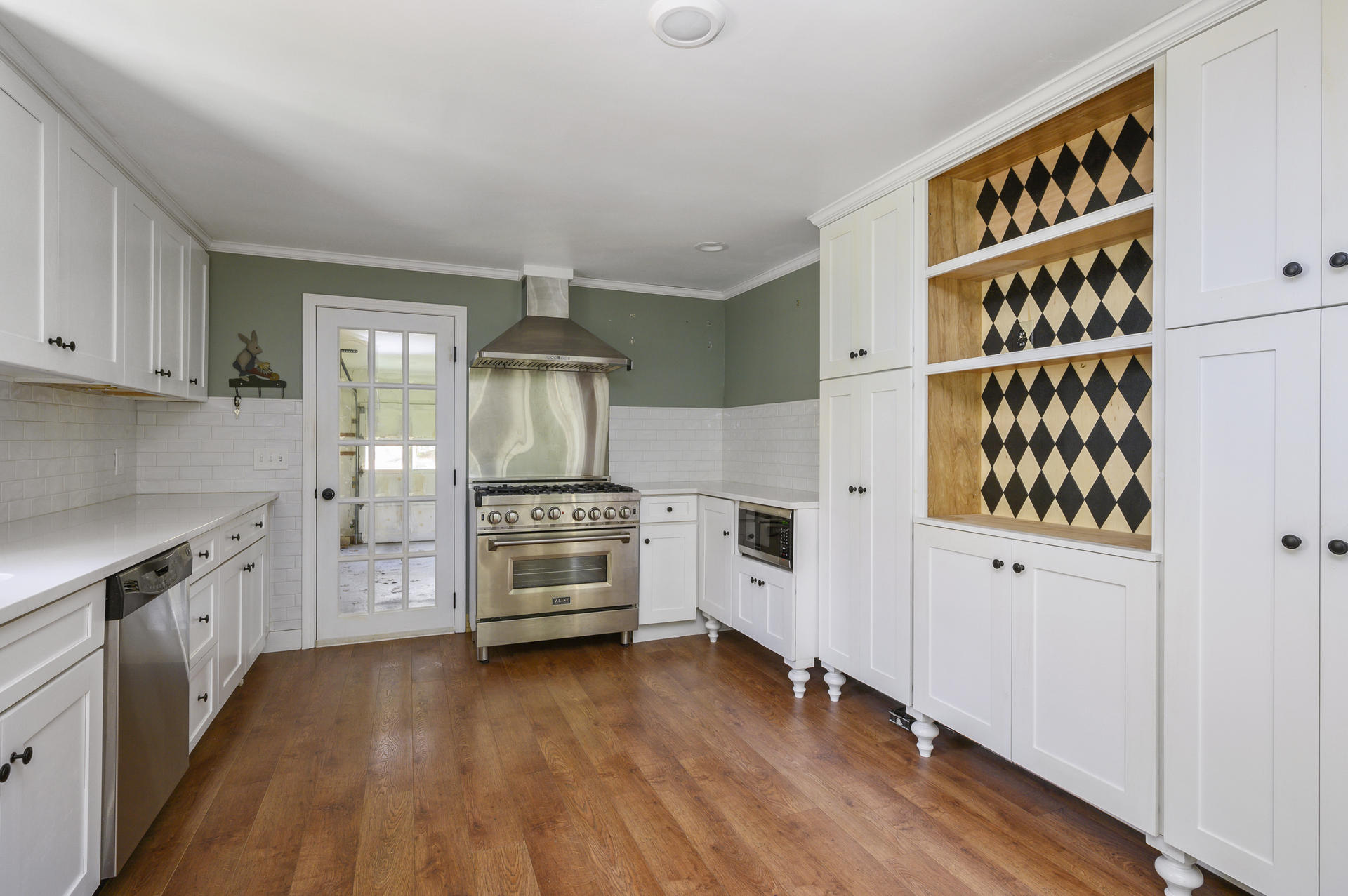 129 Richardson Road Centerville, MA 02632 - Photo 9 of 24 a kitchen with stainless steel appliances a refrigerator and cabinets