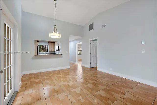 a view of a kitchen with a sink and a window