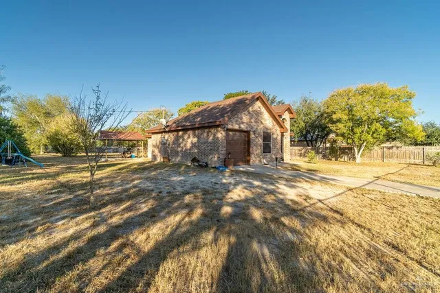 a view of house with a street