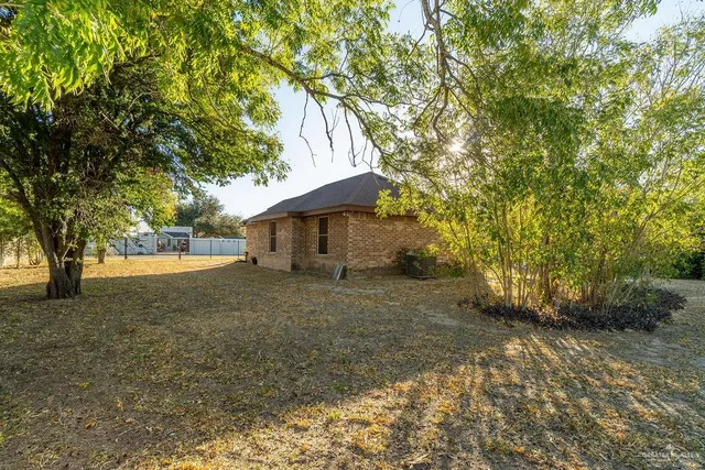 a view of a house with a tree