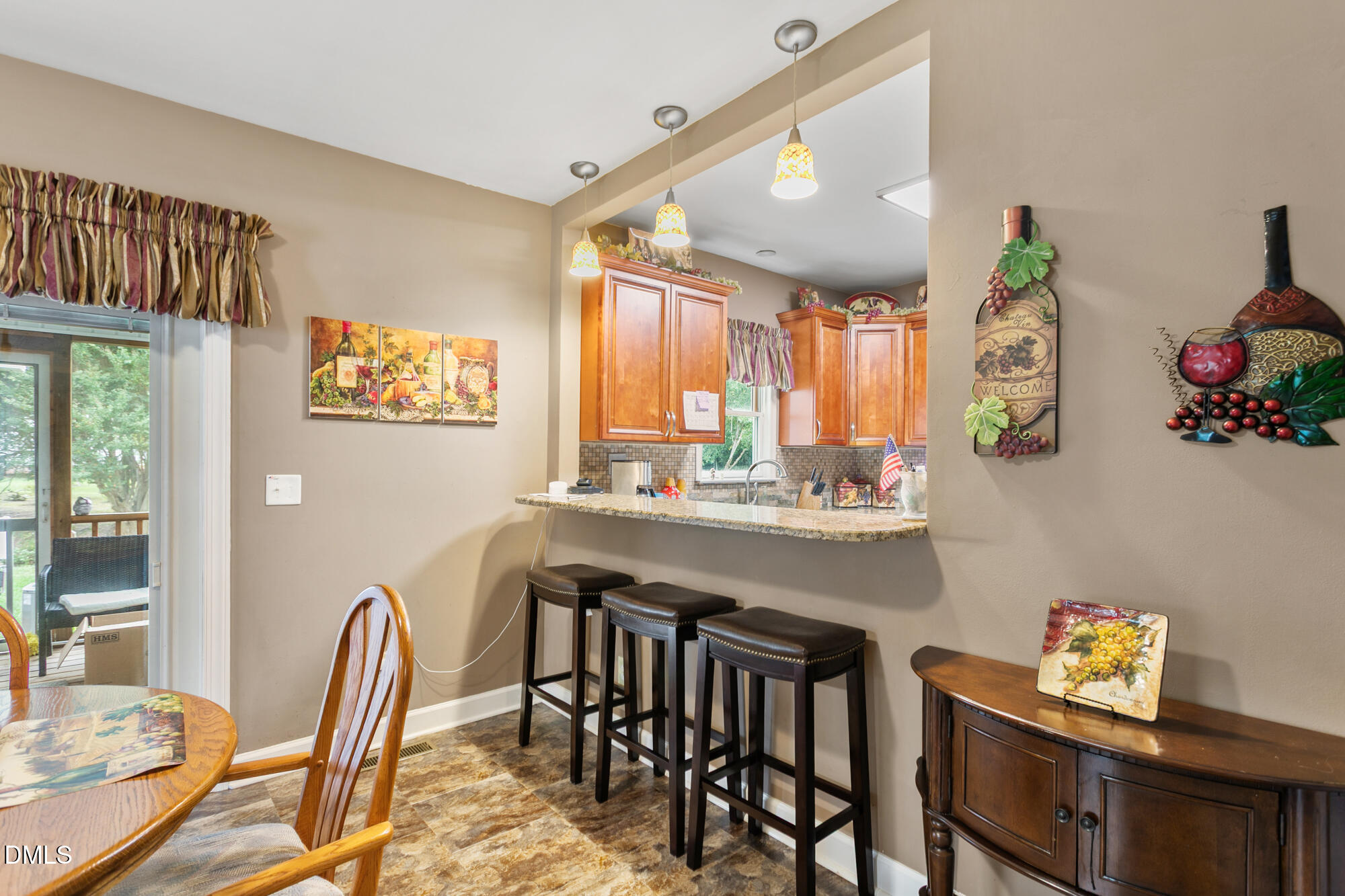 3163 Saul Loop Road Elon, NC 27244 - Photo 11 of 44 a kitchen with a table and chairs in it