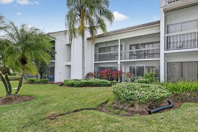 an aerial view of house with yard swimming pool and outdoor seating