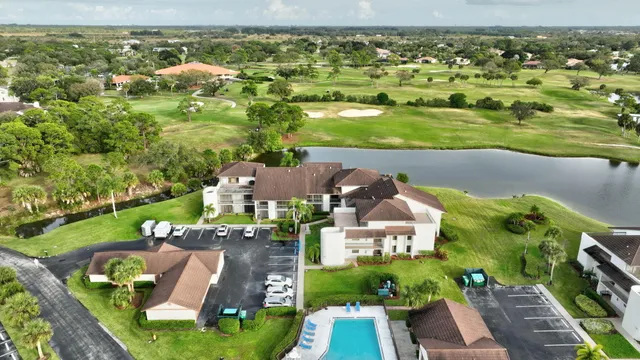 a view of a lake with a house in the background
