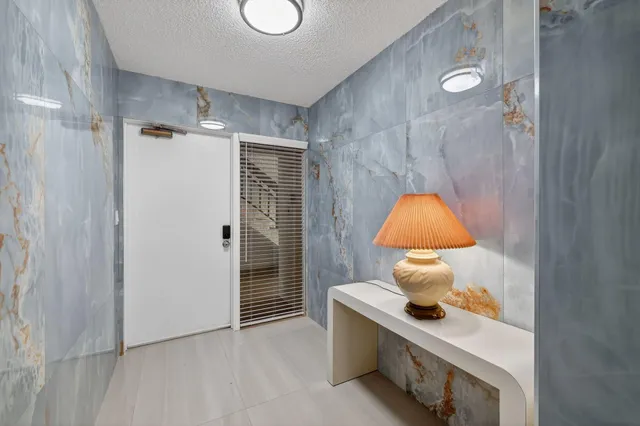 a room with a lamp and a table in it