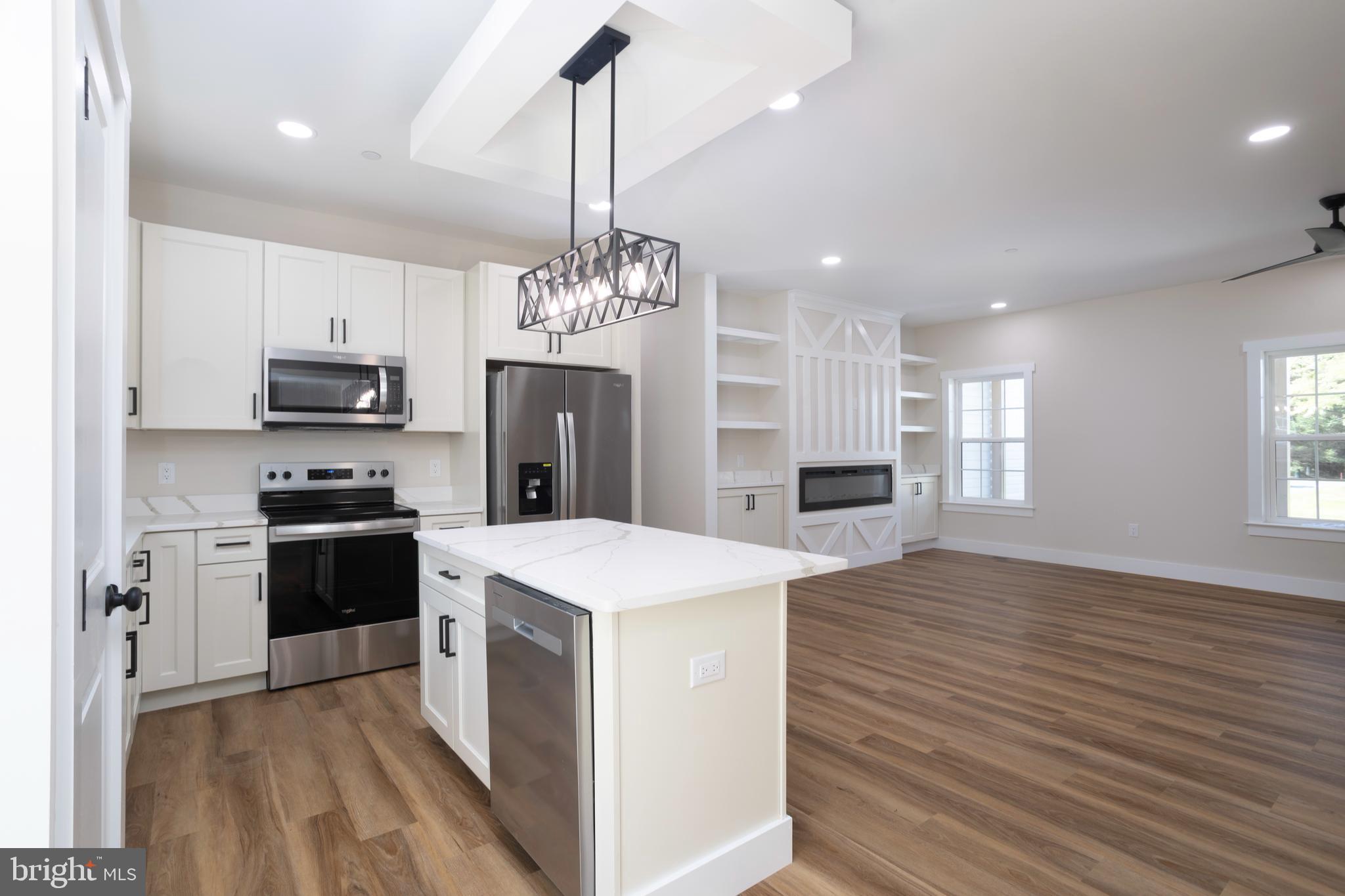 Clark Corner Road Centreville, MD 21617 - Photo 5 of 43 a large kitchen with stainless steel appliances granite countertop a stove and a sink