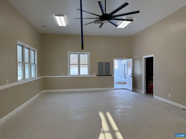 an empty room with closet and a bathroom