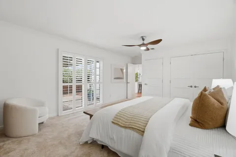 a bedroom with a bed and a couch