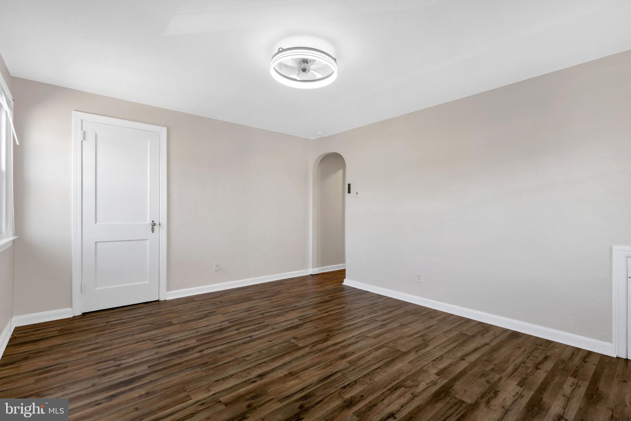 198 Sherbrook Boulevard Upper Darby, PA 19082 - Photo 14 of 30 a view of an empty room with wooden floor and a window