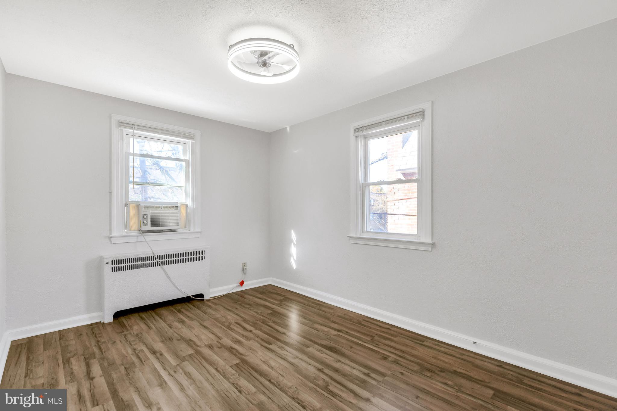 198 Sherbrook Boulevard Upper Darby, PA 19082 - Photo 17 of 30 an empty room with wooden floor and windows