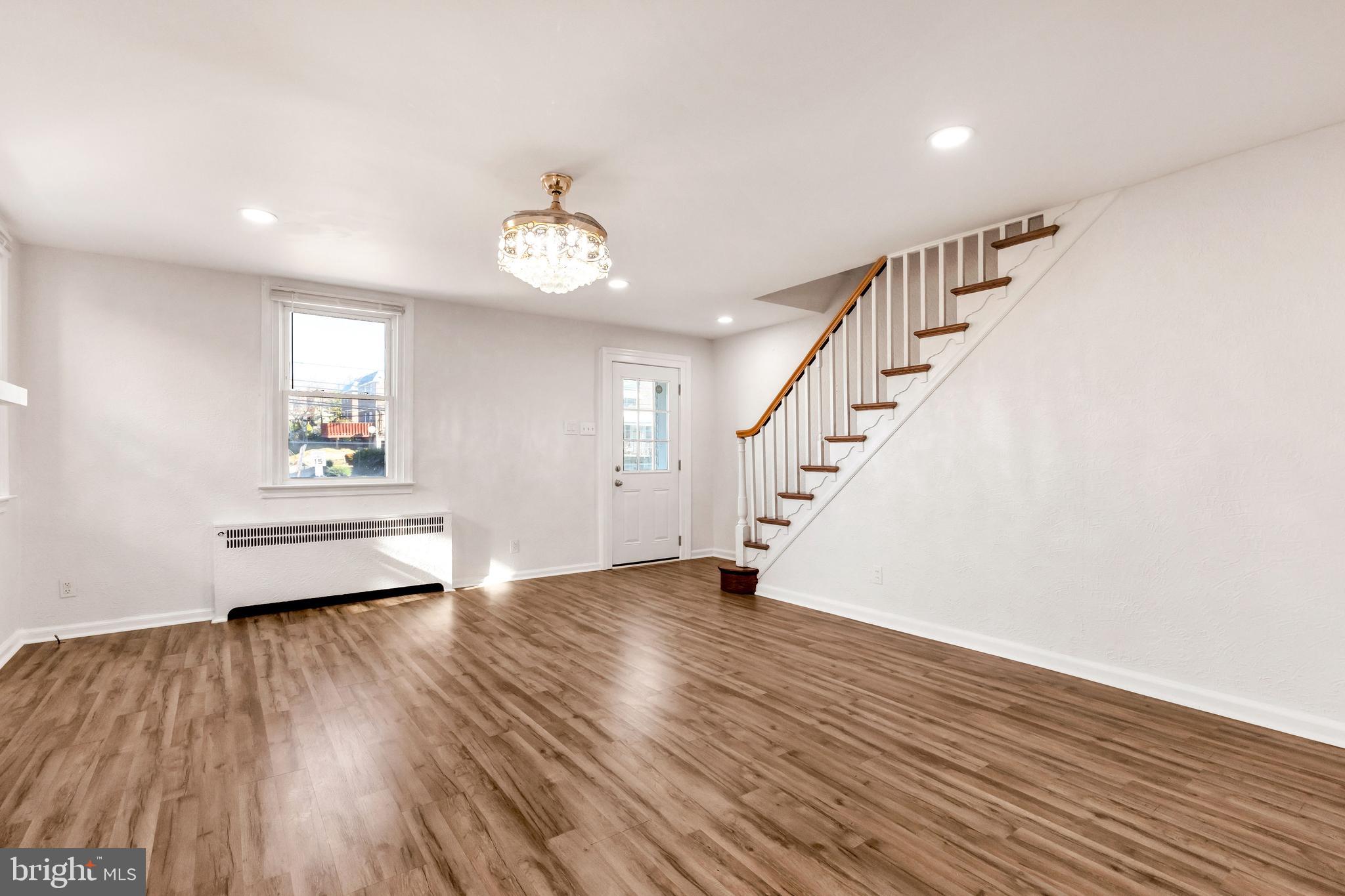 198 Sherbrook Boulevard Upper Darby, PA 19082 - Photo 5 of 30 wooden floor in an empty room with a window