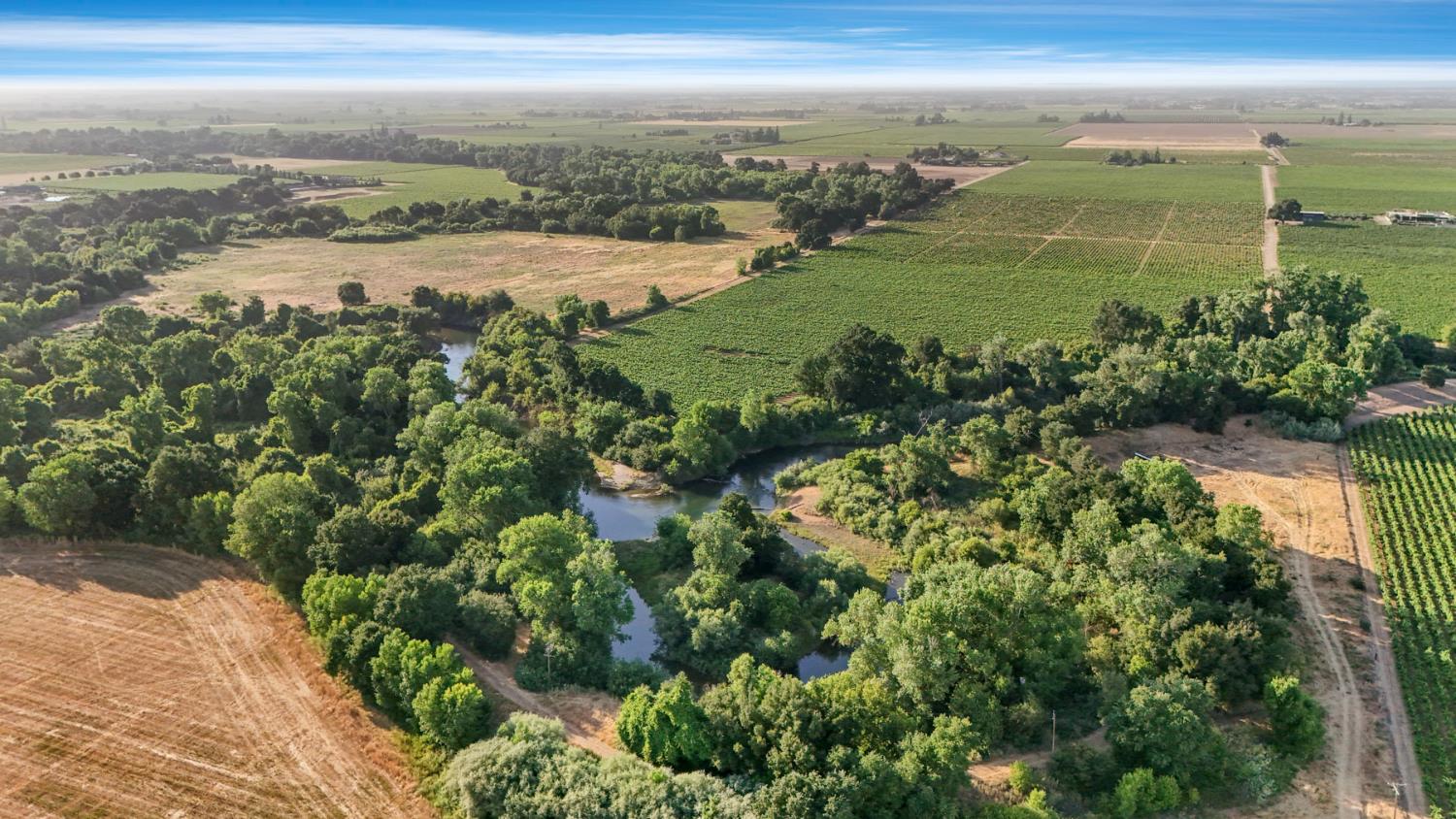 18050 North Tretheway Road Lodi, CA 95240 - Photo 6 of 37 a view of a lake with a big yard