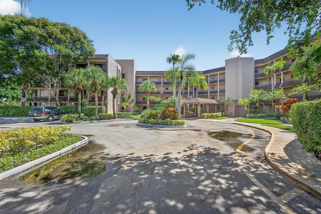 a view of a building with a yard