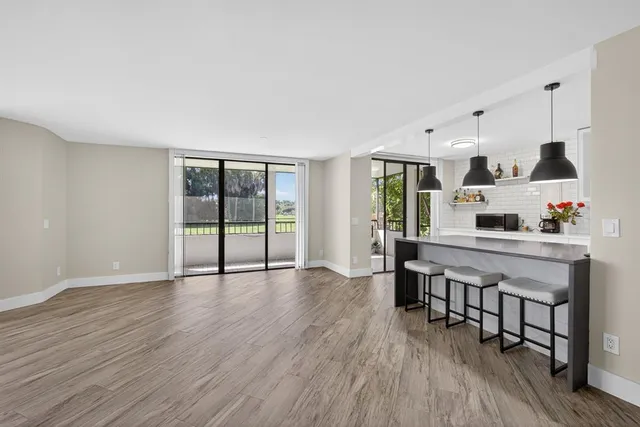 a living room with furniture and windows