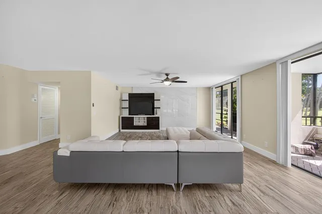 a view of a room with wooden floor and stairs