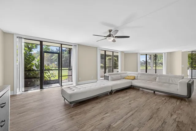 a bathroom with a toilet a sink and a large mirror