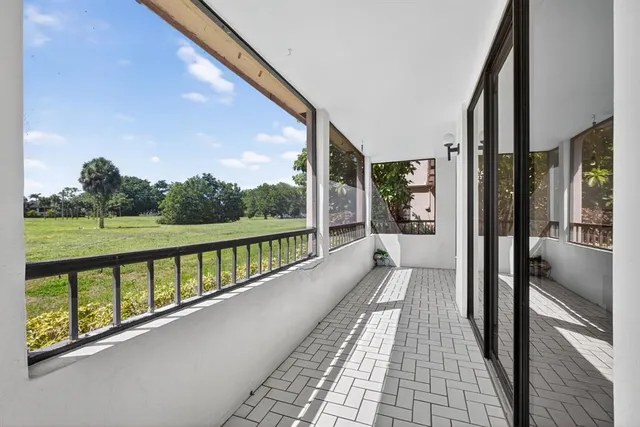 a view of a house with a backyard and a garden