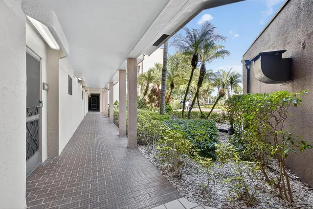 a view of a bedroom with wooden floor