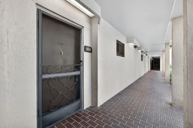 a kitchen with a refrigerator and sink