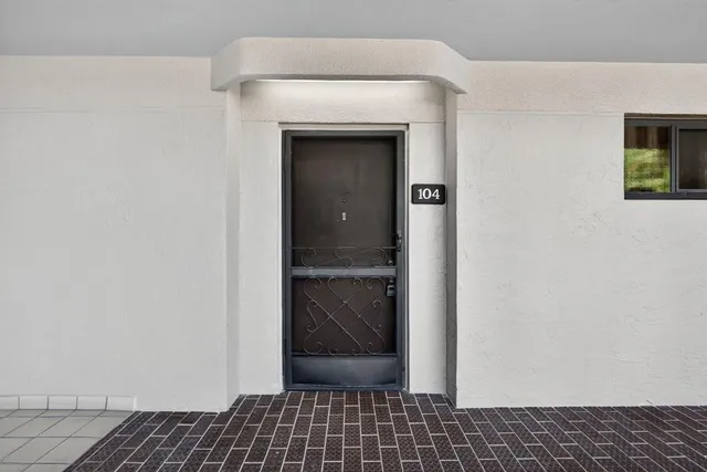 a bathroom with a double vanity sink and a window