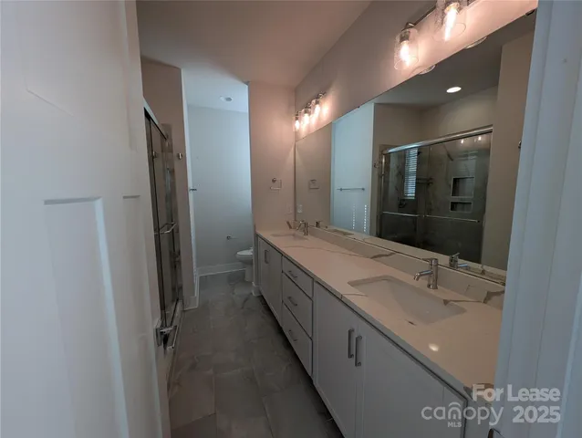 a bathroom with a shower and toilet