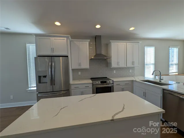 a lobby with furniture and window